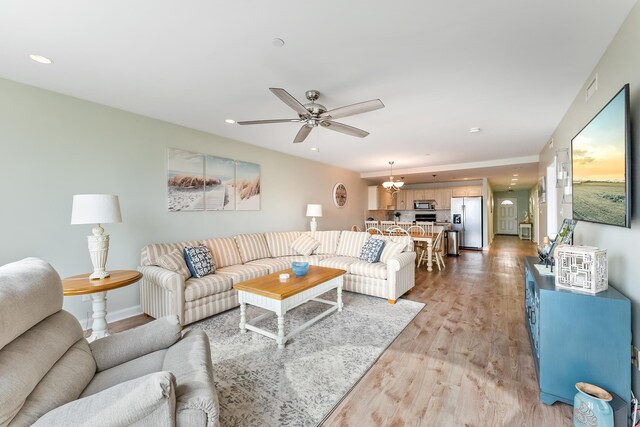 415 E Heather Rd Unit 105, Wildwood Crest, NJ 08260 - living room with light wood-style flooring, recessed lighting, ceiling fan, and baseboards