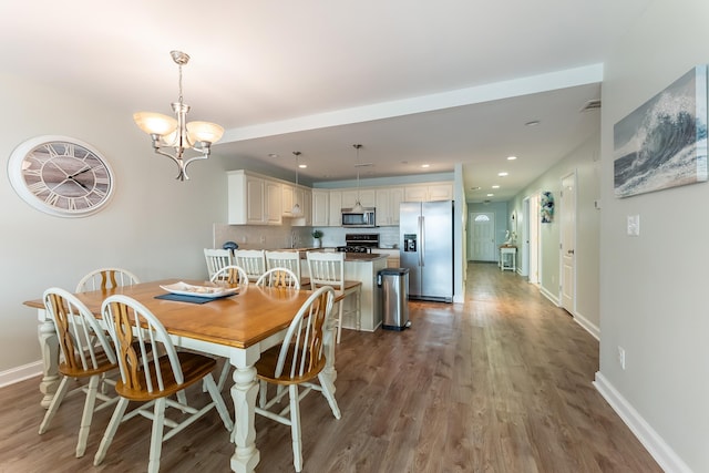 415 E Heather Rd Unit 105, Wildwood Crest, NJ 08260 - dining space featuring wood finished floors, a chandelier, baseboards, and recessed lighting