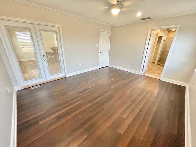 spare room with ceiling fan, french doors, crown molding, and dark hardwood / wood-style flooring