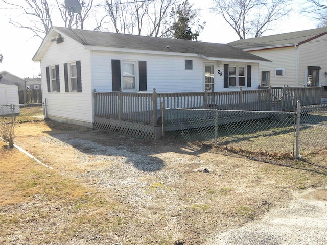 view of front of home featuring a wooden deck and fence