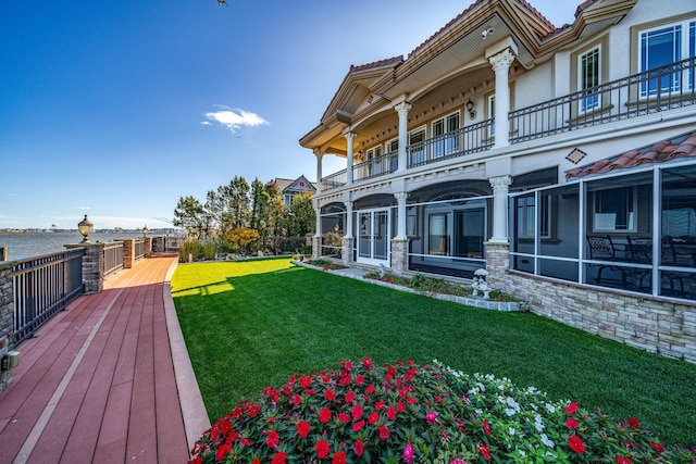 view of yard with a balcony