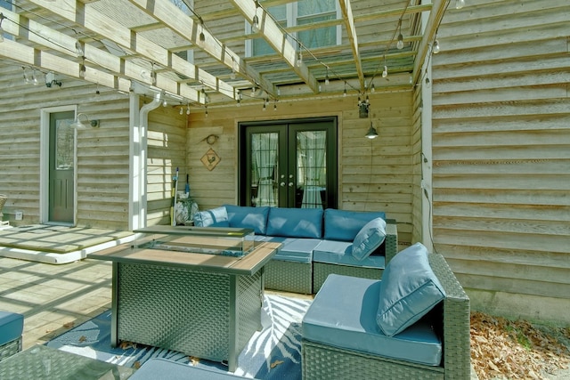 view of patio with an outdoor living space and french doors
