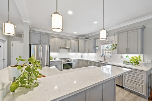 kitchen featuring appliances with stainless steel finishes, gray cabinets, visible vents, and a sink