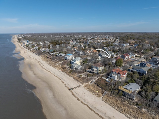 aerial view with a water view and a view of the beach