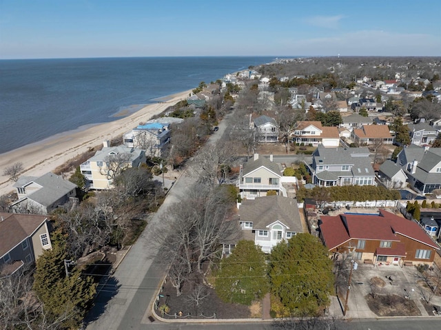 bird's eye view with a beach view, a residential view, and a water view