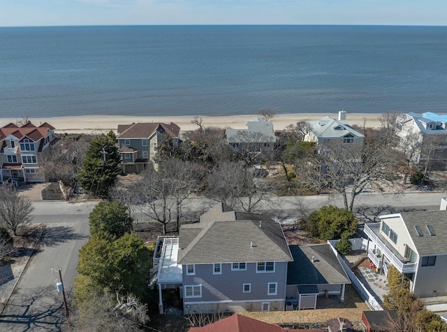 bird's eye view featuring a water view and a residential view