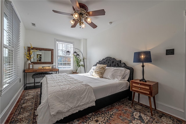 bedroom featuring ceiling fan and dark hardwood / wood-style flooring