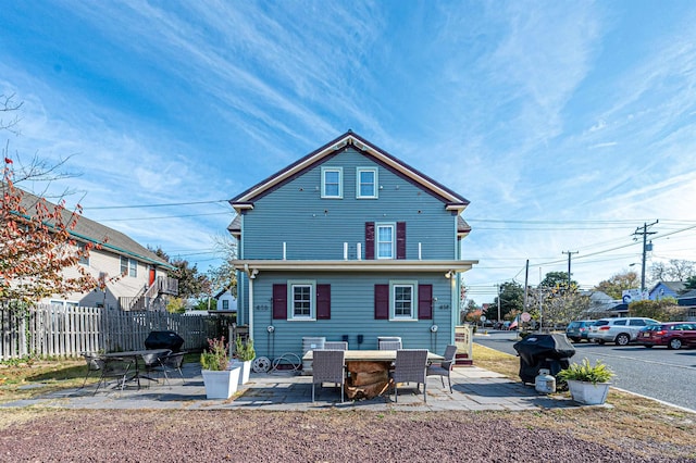 rear view of property featuring a patio