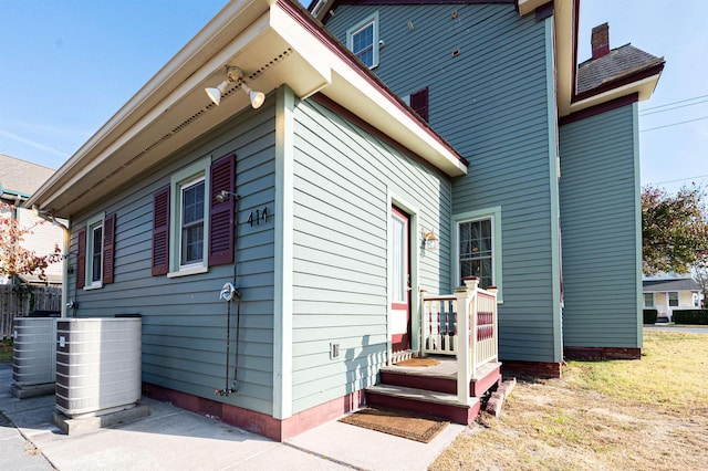 view of property exterior with cooling unit