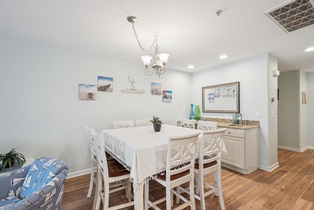 410 E Orchid Rd Unit 202, Wildwood Crest, NJ 08260 - dining area with light wood-type flooring, recessed lighting, and a chandelier