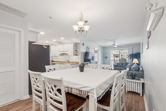 410 E Orchid Rd Unit 202, Wildwood Crest, NJ 08260 - dining room with recessed lighting, wood finished floors, ceiling fan, and a chandelier