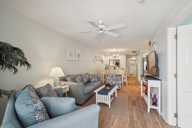 410 E Orchid Rd Unit 202, Wildwood Crest, NJ 08260 - living room with ceiling fan and light wood-style floors