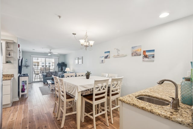 410 E Orchid Rd Unit 202, Wildwood Crest, NJ 08260 - dining area with light wood-type flooring, a ceiling fan, a chandelier, and recessed lighting