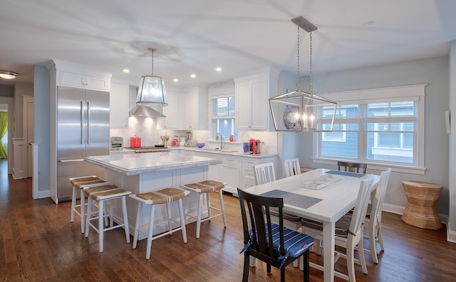 885 21st St W, Unit West, Avalon, NJ 08202 - dining area with dark wood-style flooring, a chandelier, and recessed lighting