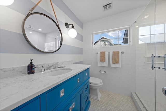 19 Flamingo Dr, Avalon, NJ 08202 - bathroom featuring tile patterned floors, a shower with door, vanity, and toilet
