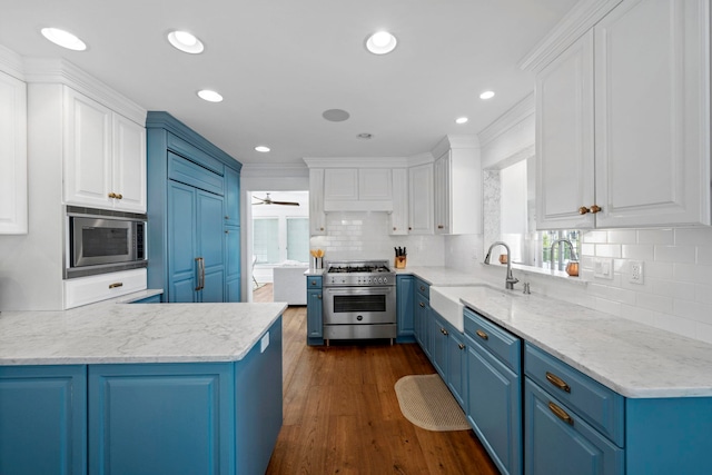 19 Flamingo Dr, Avalon, NJ 08202 - kitchen with blue cabinets, sink, ceiling fan, appliances with stainless steel finishes, and white cabinetry