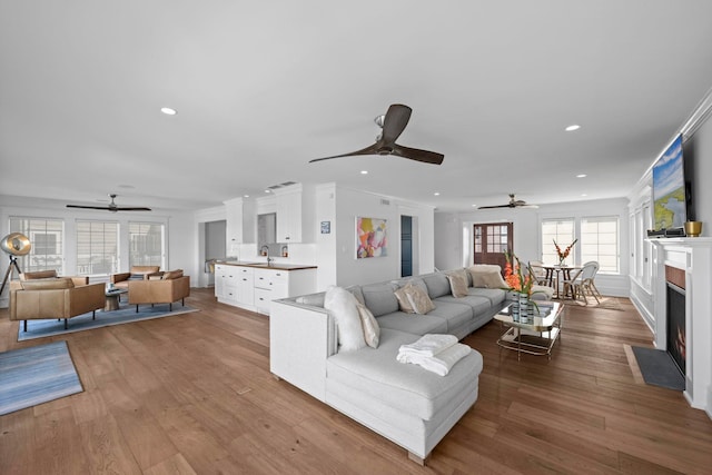 19 Flamingo Dr, Avalon, NJ 08202 - living room with crown molding, sink, and light wood-type flooring