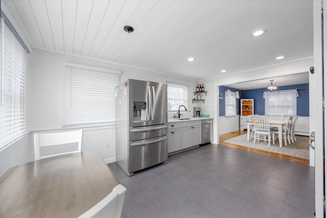 103 Bate Ave, Lower Township, NJ 08204 - kitchen with hanging light fixtures, stainless steel appliances, tasteful backsplash, wood ceiling, and sink