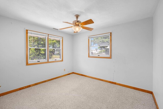 1301 Holmes Ave, North Cape May, NJ 08204 - carpeted empty room featuring healthy amount of natural light, ceiling fan, and a textured ceiling