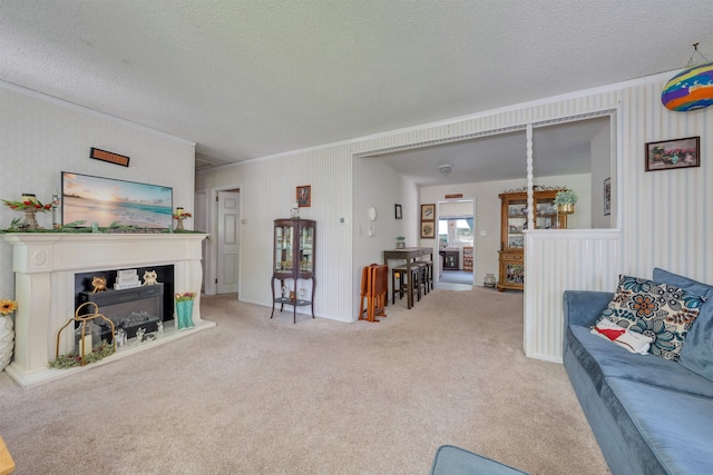 11 S 9th St, Del Haven, NJ 08251 - living room featuring a textured ceiling, light colored carpet, a fireplace, and crown molding