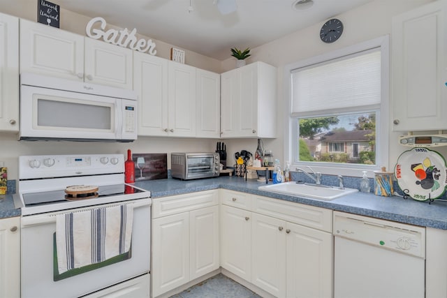 11 S 9th St, Del Haven, NJ 08251 - kitchen featuring white appliances, white cabinetry, and dark countertops