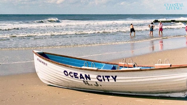 property view of water featuring a beach view