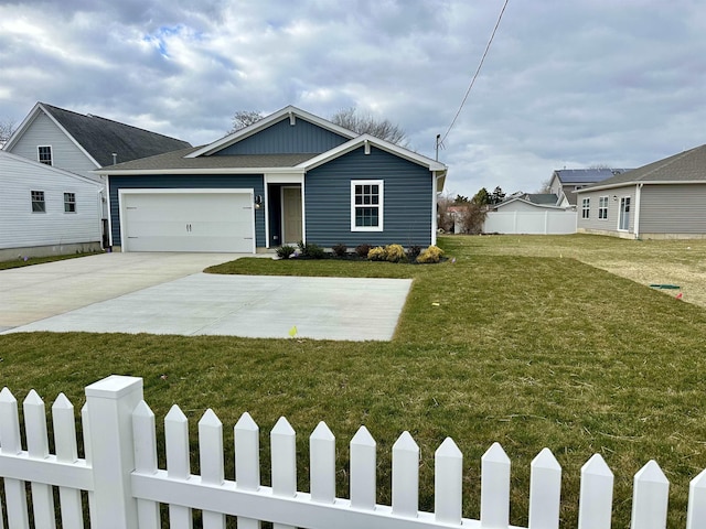 view of front of house featuring a front yard and a garage