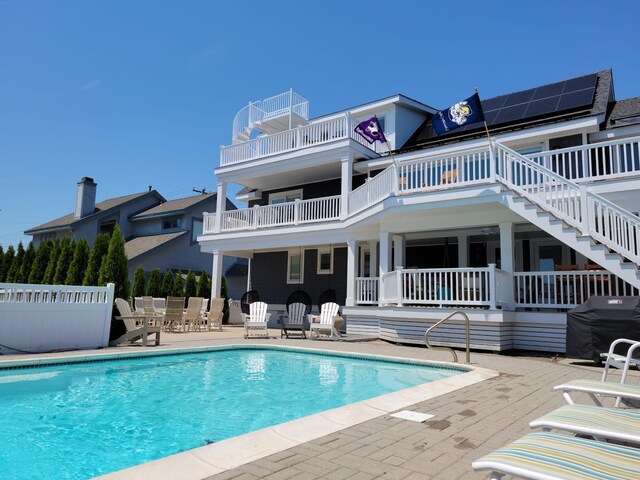 7749 Dune Dr, Avalon, NJ 08202 - swimming pool featuring stairway, a patio area, and grilling area