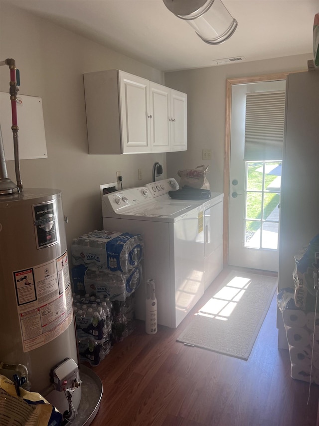 407 Elmwood Ave, Marmora, NJ 08223 - clothes washing area with washer and dryer, gas water heater, dark wood-type flooring, and cabinets