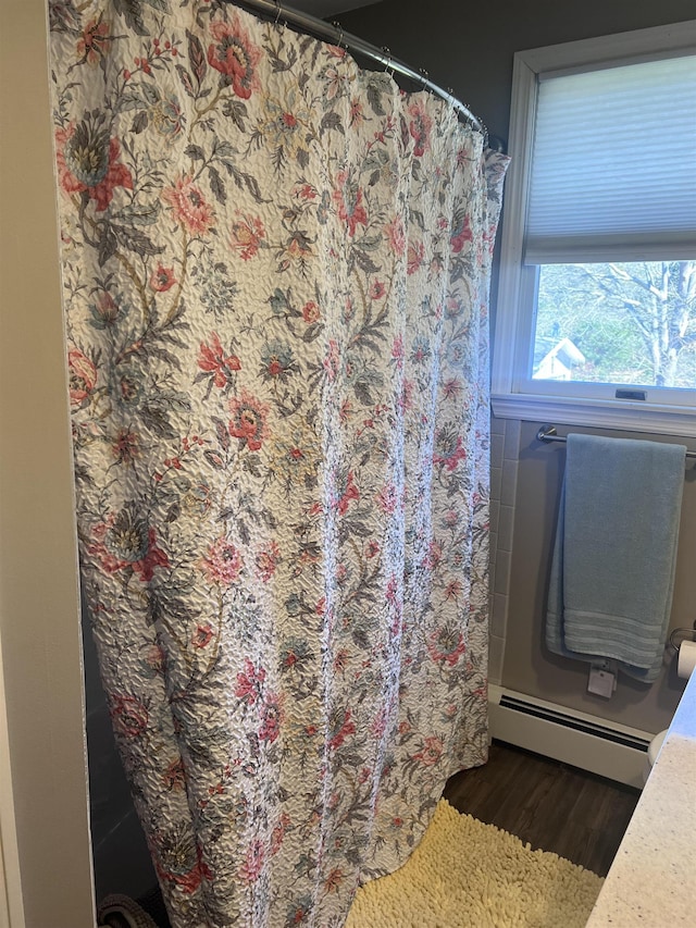 407 Elmwood Ave, Marmora, NJ 08223 - bathroom featuring wood-type flooring and a baseboard heating unit