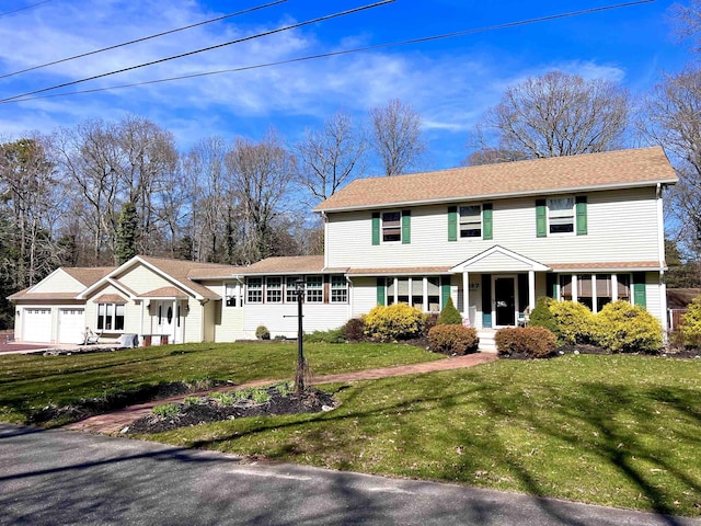 407 Elmwood Ave, Marmora, NJ 08223 - view of front facade with a front yard and a garage
