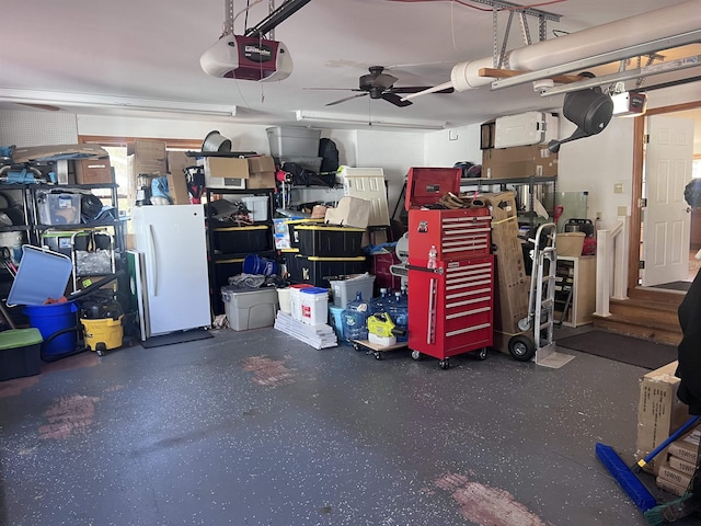 407 Elmwood Ave, Marmora, NJ 08223 - garage with ceiling fan, white fridge, and a garage door opener