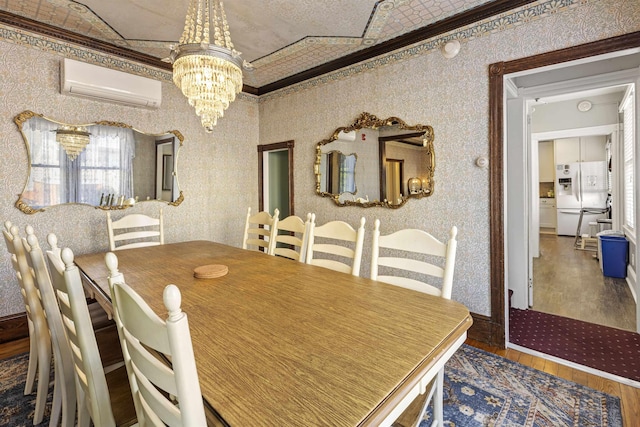 127 Myrtle Ave, West Cape May, NJ 08204 - dining space with an AC wall unit, wood finished floors, a chandelier, crown molding, and wallpapered walls