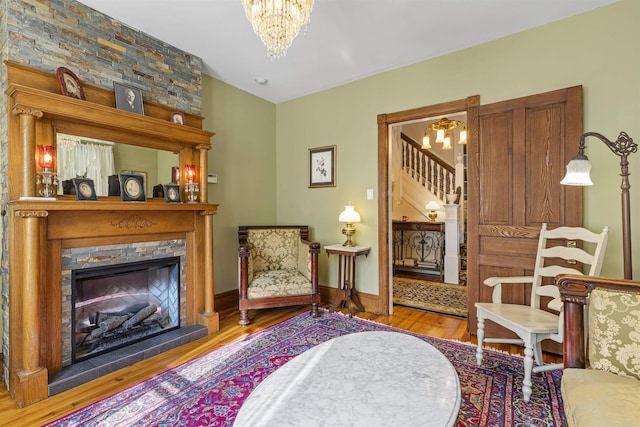 127 Myrtle Ave, West Cape May, NJ 08204 - sitting room featuring a chandelier, wood finished floors, and a fireplace