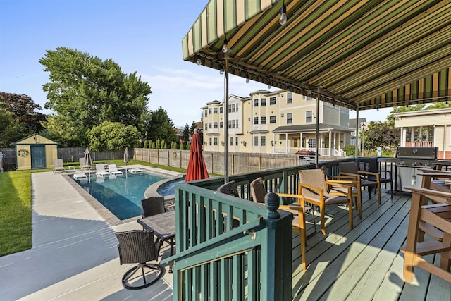 127 Myrtle Ave, West Cape May, NJ 08204 - wooden terrace featuring a grill, a fenced backyard, and a storage unit