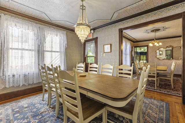 127 Myrtle Ave, West Cape May, NJ 08204 - dining area featuring a chandelier, crown molding, wallpapered walls, and wood finished floors