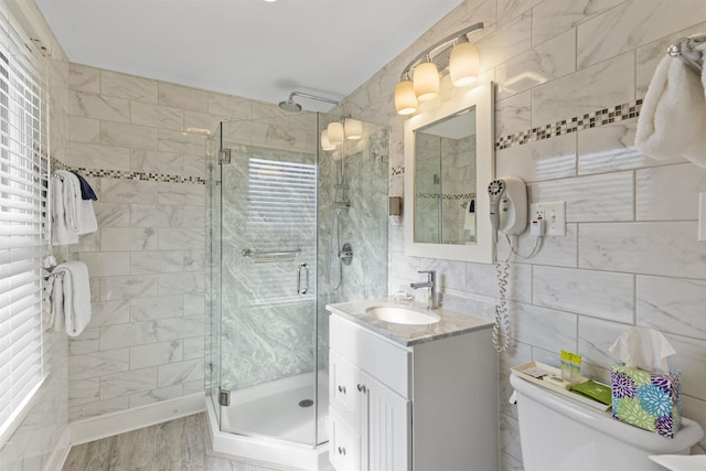 127 Myrtle Ave, West Cape May, NJ 08204 - bathroom featuring vanity, tile walls, a stall shower, and wood finished floors