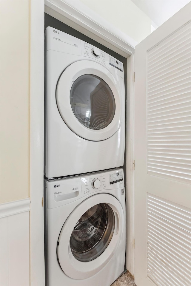 280 79th St Unit 4, Avalon, NJ 08202 - washroom with stacked washing machine and dryer and wainscoting