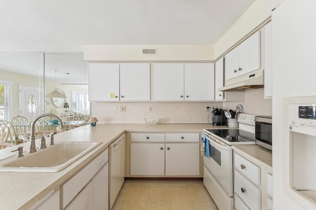 280 79th St Unit 4, Avalon, NJ 08202 - kitchen featuring white appliances, under cabinet range hood, a sink, and healthy amount of natural light