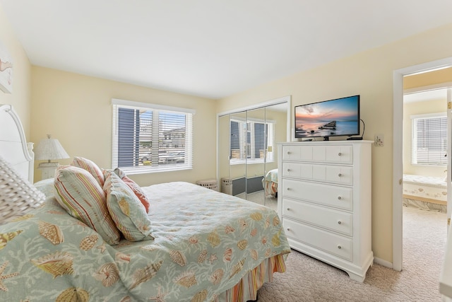 280 79th St Unit 4, Avalon, NJ 08202 - bedroom with light carpet, multiple windows, a closet, and baseboards