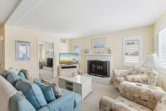 280 79th St Unit 4, Avalon, NJ 08202 - living room featuring a fireplace, plenty of natural light, and light carpet