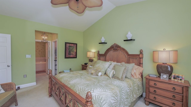 carpeted bedroom featuring ceiling fan with notable chandelier, lofted ceiling, and connected bathroom