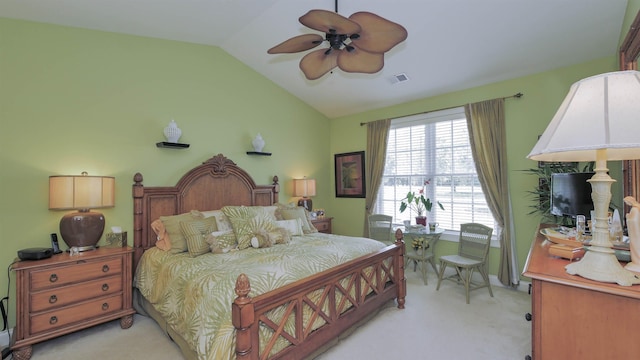 carpeted bedroom with ceiling fan and lofted ceiling