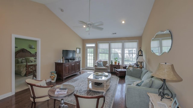 living room featuring ceiling fan, dark hardwood / wood-style flooring, and high vaulted ceiling