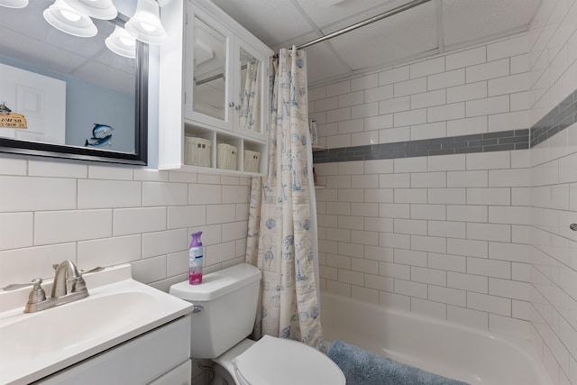 full bathroom with tile walls, decorative backsplash, vanity, toilet, and shower / bathtub combination with curtain