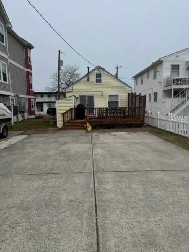 exterior space with a wooden deck and fence