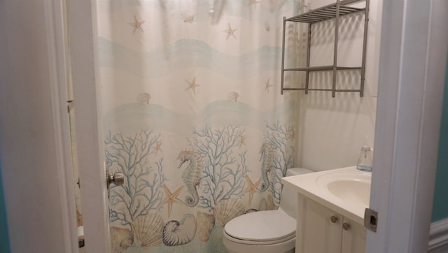 bathroom featuring vanity and toilet