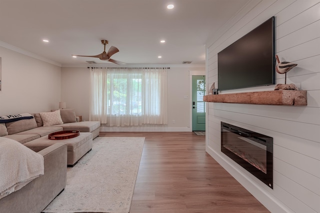 963 Tecumseh Rd, Erma, NJ 08204 - living area featuring ornamental molding, recessed lighting, light wood-type flooring, ceiling fan, and a glass covered fireplace