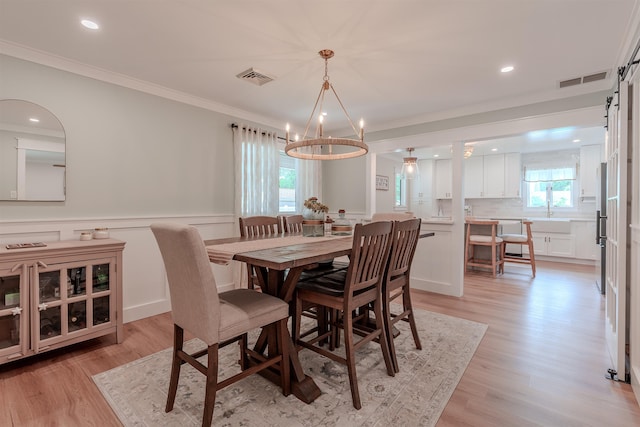 963 Tecumseh Rd, Erma, NJ 08204 - dining room featuring a chandelier, crown molding, light wood finished floors, a wainscoted wall, and recessed lighting