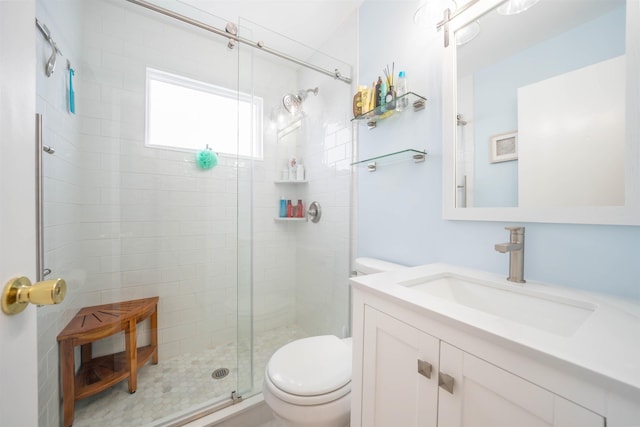 bathroom with vanity, toilet, and walk in shower